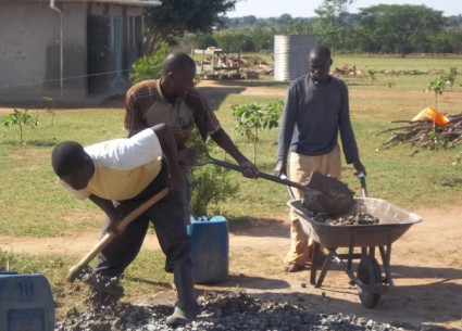 2014 - Local employment - Young men doing their manual labour thing assisting with the water tank stand construction.